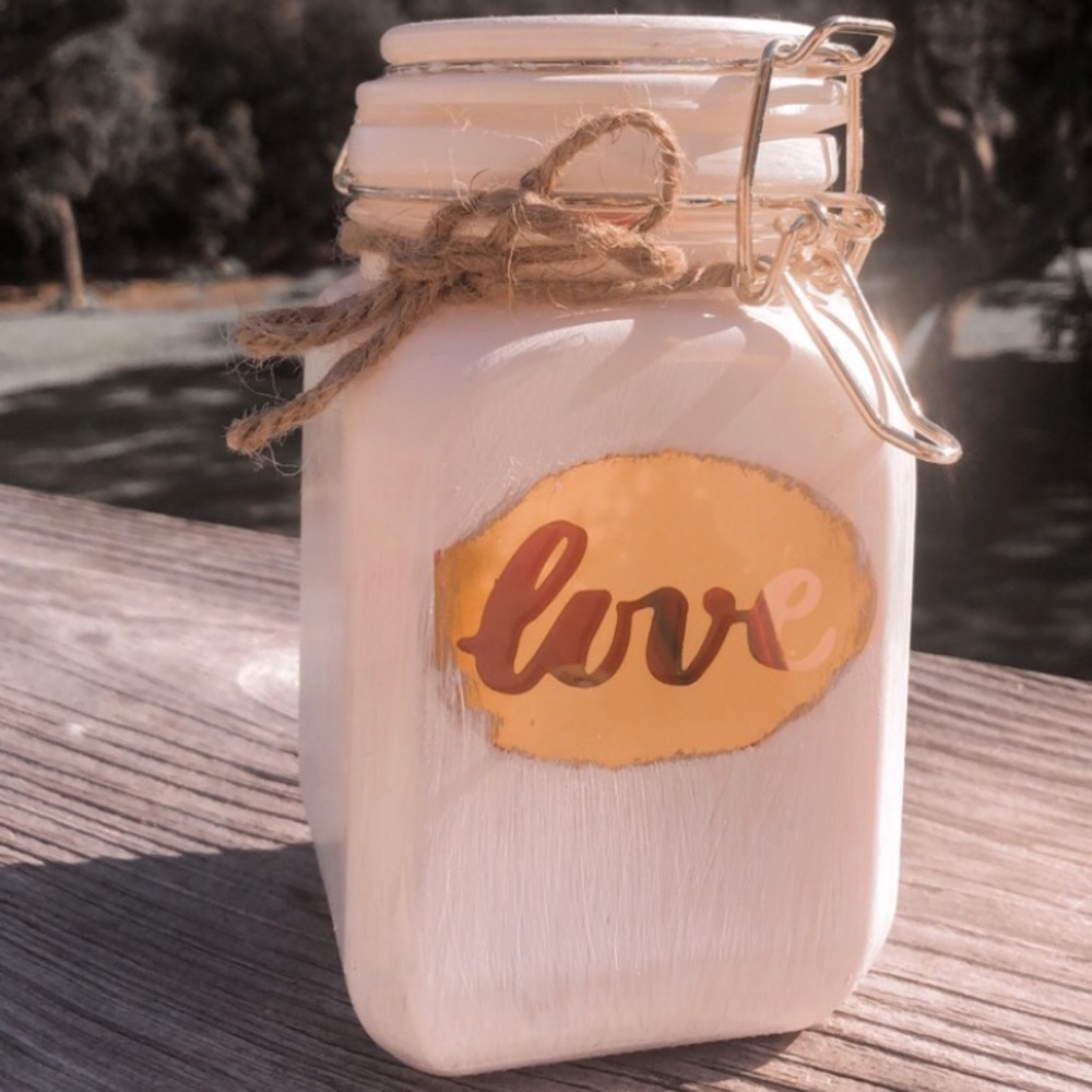 hand painted and decorated glass jar.